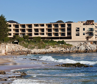 image of a hotel on the beach on a sunny day