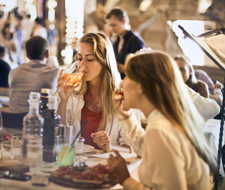 Friends enjoying dinner together at restaurant