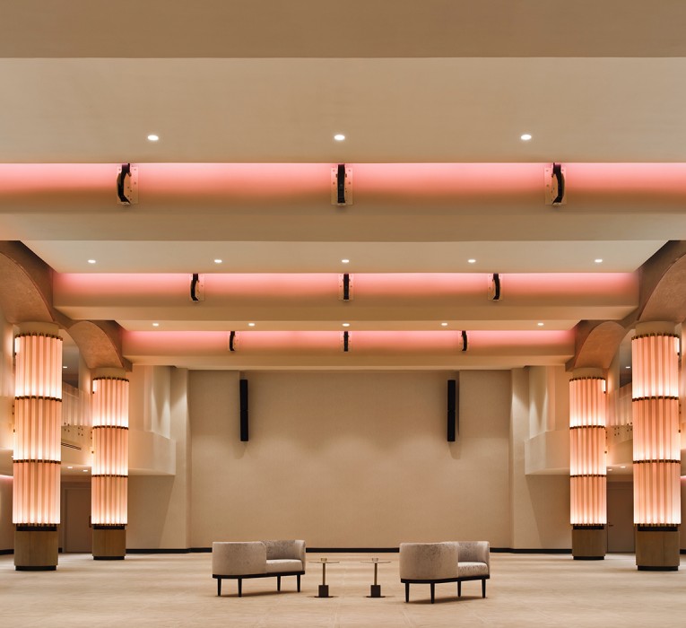 large event space with orange lights