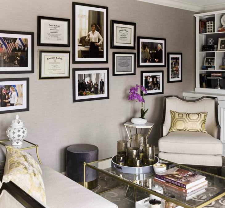 interior image of a room with tan furniture picture frames on the wall and gold accents 