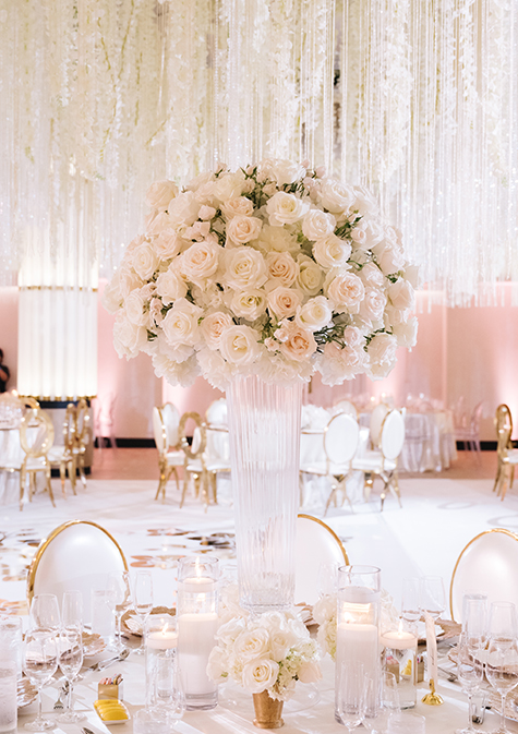 beautiful bouquet of white roses on a wedding reception table