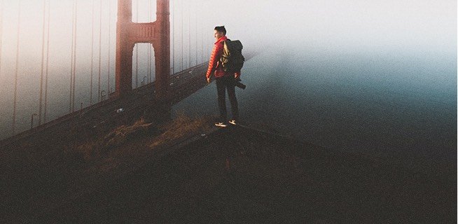 Man standing overlooking the San Francisco bridge