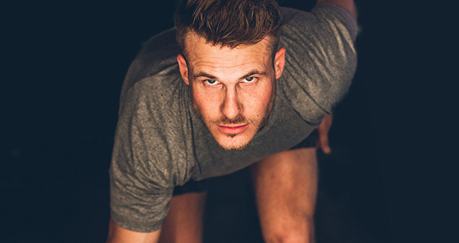 athletic man getting ready to run