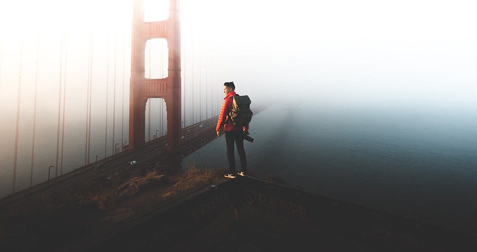 man overlooking the san francisco bridge