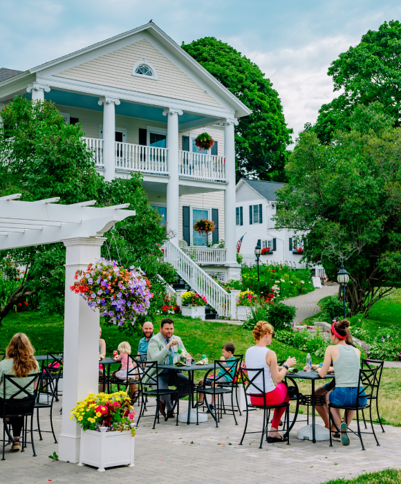 people eating at tables outside Bills Grill