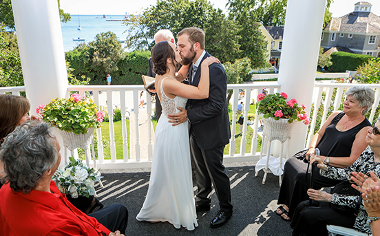View of a couple in love kissing on its wedding ceremony