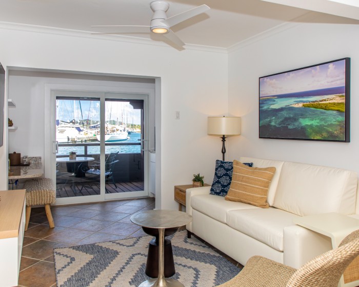 harbour suite living room with couch and view of patio