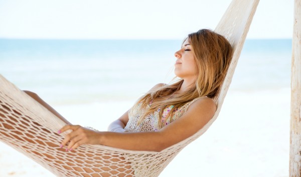 a woman lying in a hammock