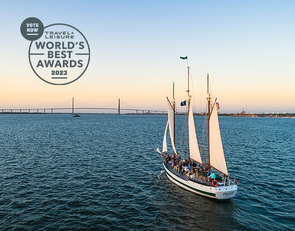 sailboat in the sunset with travel and leisure logo