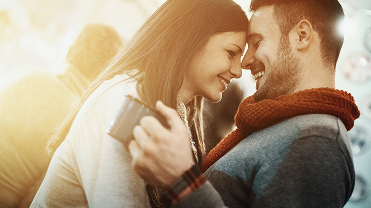 Man and women hugging in a winter setting