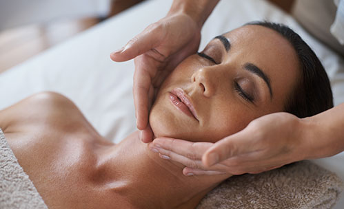Woman getting a facial massage