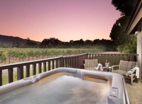 harvestinn gallery image hot tub on balcony room area with sunset in background