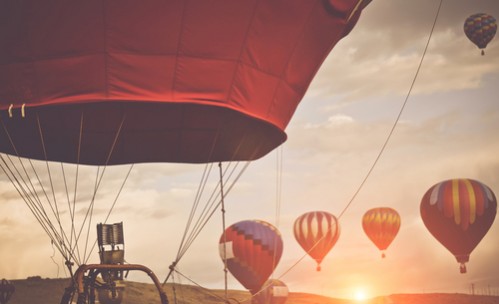 hot air balloons with sunrise