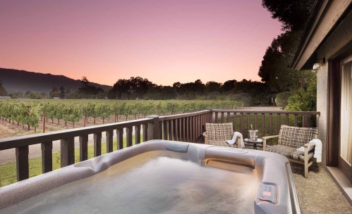 hot tub in balcony with a vineyard view