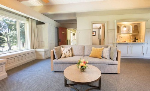 suite living room with a couch and table