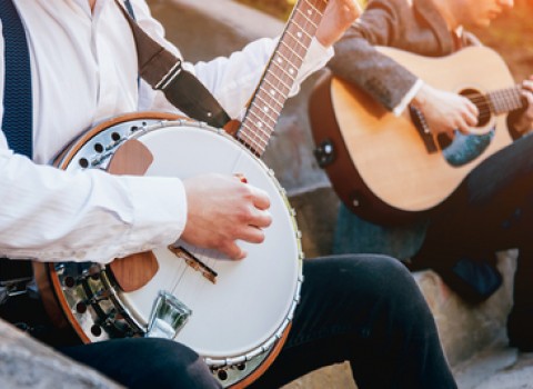 musicians playing banjo and guitar