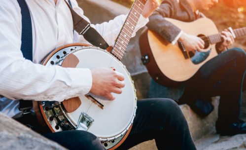musicians playing banjo and guitar