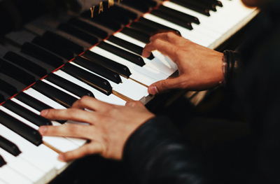 close up of someone playing piano