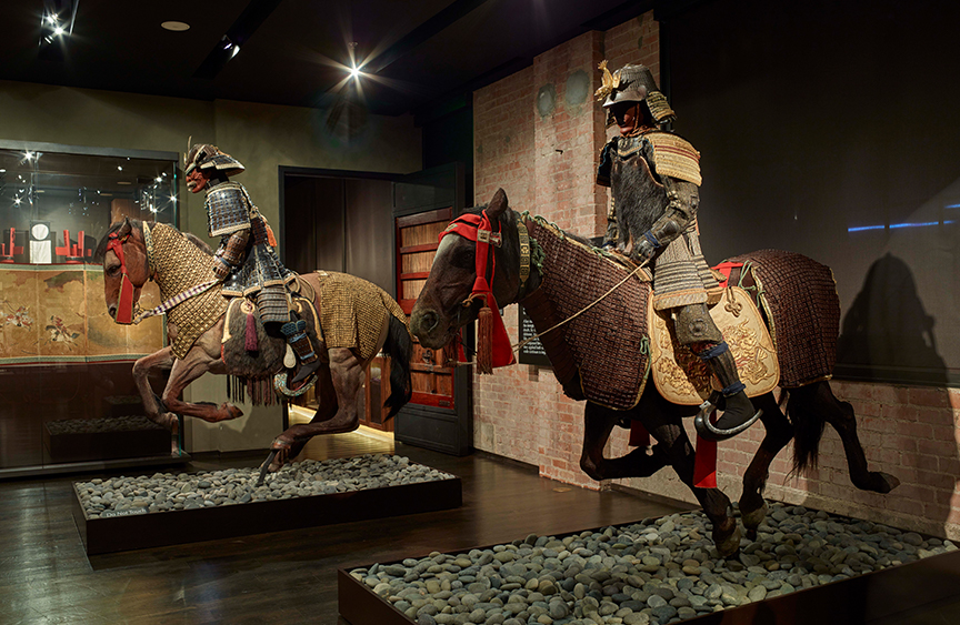 museum exhibition of two artistic horses 