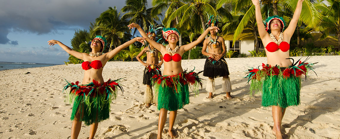 view of performers dancing on a beach