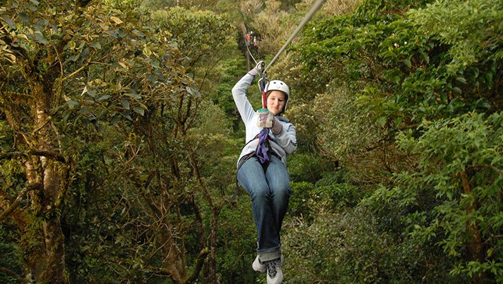 view of a woman ziplining