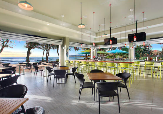beach club dining with spacious seating areas and ocean front view