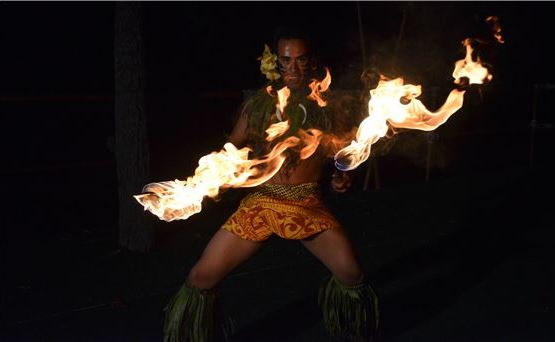 fire dancers performing at a luau