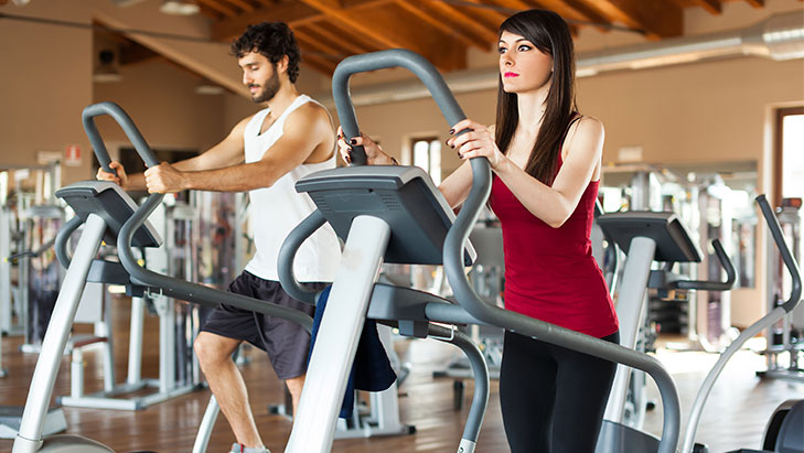 a couple working out in a fitness center