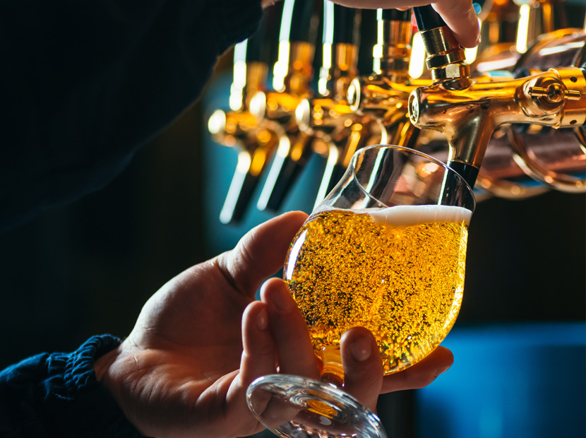 Pouring draft beer into glass