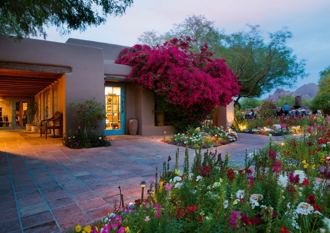 inset-Outdoor shot of the hotel with florals and greenery