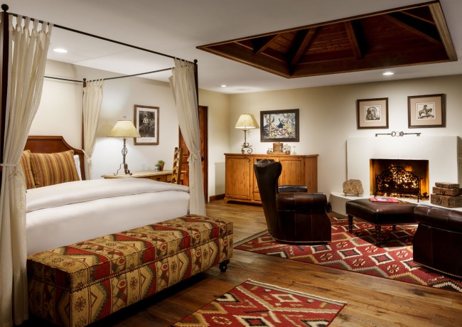 Spacious room with king bed, living space & fireplace