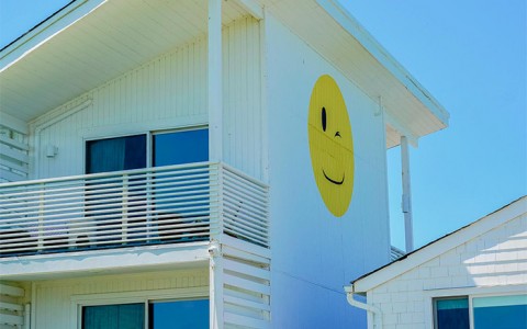 partial view of the resort with a smiley face on the side of the building