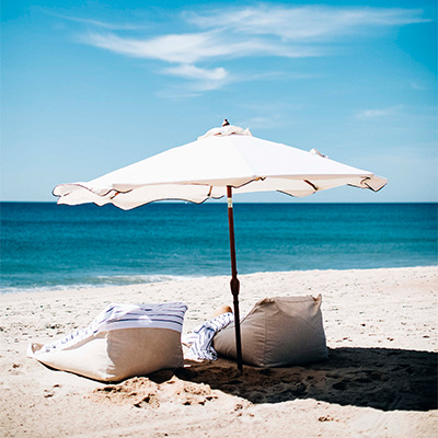 beach umbrella with beach sacks