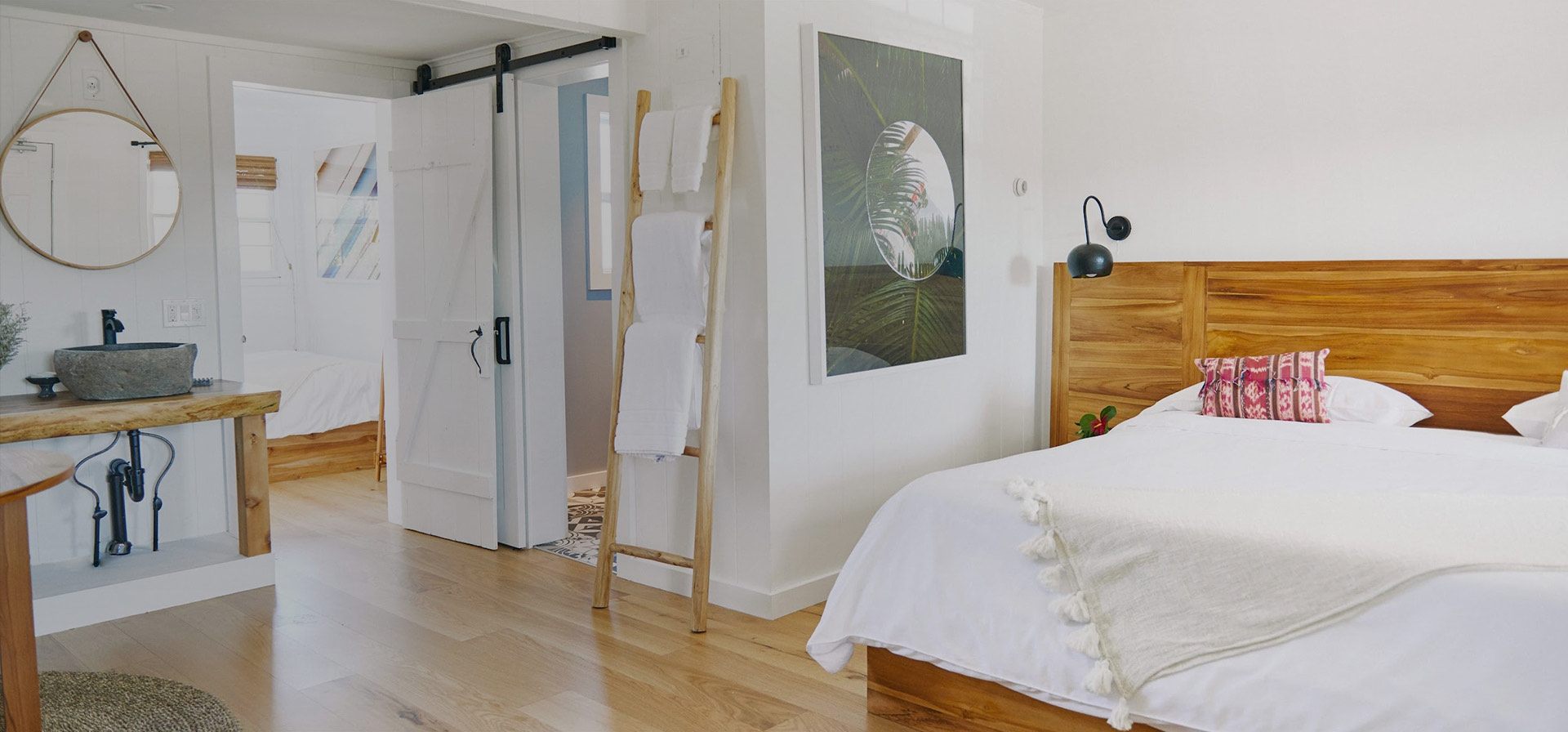 a spacious bedroom with a large bed and wooden decor