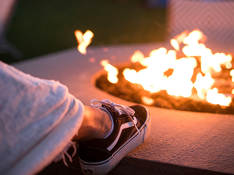 view of a foot placed on a fire pit