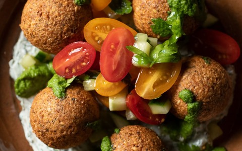 meatball dish with raw tomatoes