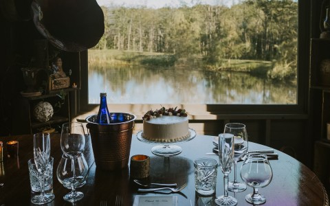 private setup on the water with a cake set on the table