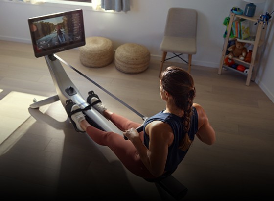 woman rowing back on a hydrow rowing machine