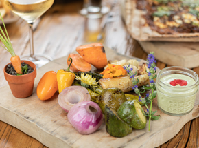 wooden board with a display of vegetables