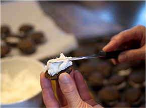 cream being spread onto whoopie pie