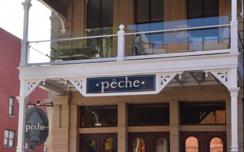 neighborhood photo showing front view of a peche store 
