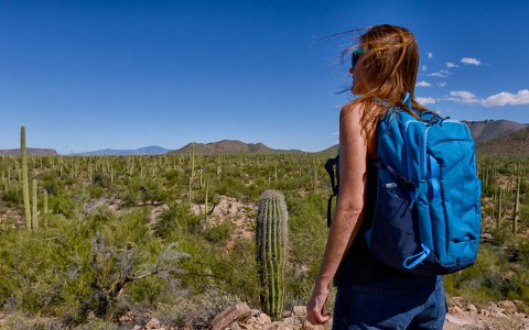 woman hiking through desert