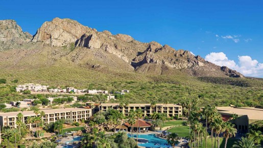 aerial view of the property and mountains in the background