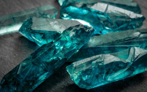 aquamarines and raw crystal gem stones.pg