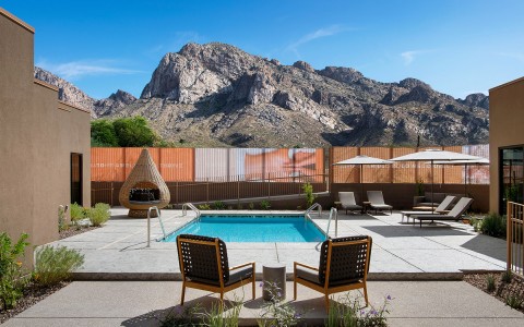 outdoor spa pool area with mountains in background