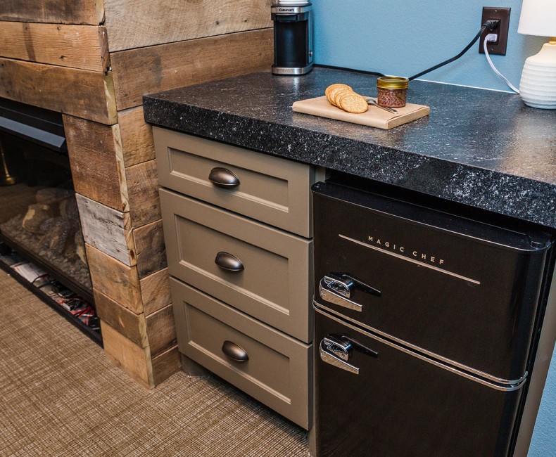 mini fridge and cabinets