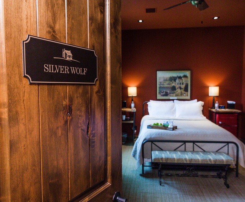 red suite entrance with queen bed