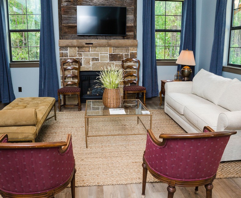living room seating area with fireplace and tv
