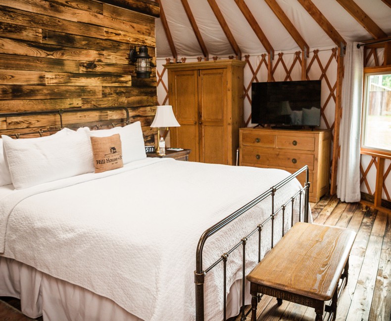 comfy bed inside luxury yurt