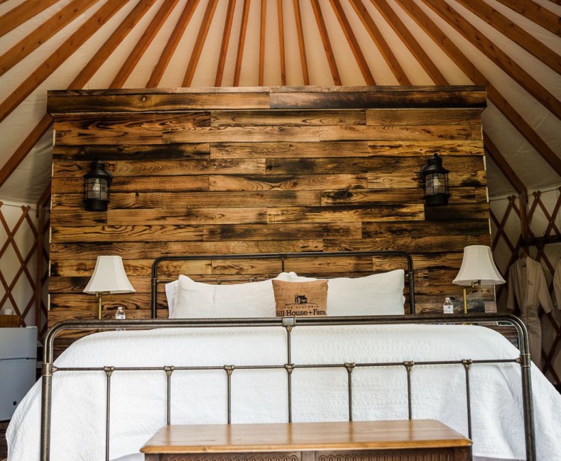 Large comfy bed in luxury yurt